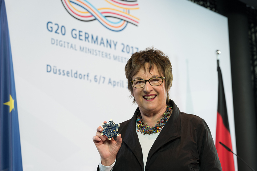 Federal Minister for Economic Affairs and Energy Brigitte Zypries holding the Calliope mini computer that is to help elementary school students use digital technologies in a playful manner.